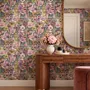 Bold wallpaper for powder room with pop art female faces, pink flowers, black comic panels, mustard, teal and fuchsia details