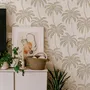 Muted sandy taupe palm trees and pale foliage on a creamy ivory ground tropical wallpaper