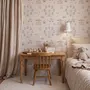 Children's playroom wallpaper with pastel Ferris wheel, carousel horses, tents and balloons on blush pink