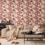 Tropical foliage wallpaper with black panthers, pink palace facades and ochre palms on pale peach