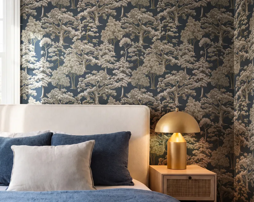 Navy wallpaper with warm ivory and taupe grey toile tree repeat on deep slate blue ground
