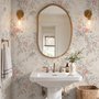 Pink chinoiserie wallpaper with watercolor flowers, blue-grey leaves and red berries on a cream linen-texture ground