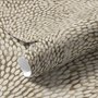 Abstract taupe and greige wallpaper with creamy white oval brush marks in flowing currents