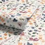 Watercolour floral wallpaper repeat with navy, blue, blush and peach wildflowers on warm cream