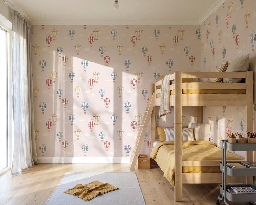 Hot air balloon nursery room wallpaper with watercolour balloons, clouds and stars on a soft blush-pink ground
