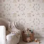 Children's playroom wallpaper with pastel Ferris wheel, carousel horses, tents and balloons on blush pink
