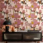 Tropical foliage wallpaper with black panthers, pink palace facades and ochre palms on pale peach