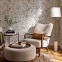 Black outline botanical wallpaper with charcoal wildflowers and grasses on a warm ivory cream ground