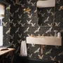 Ivory cranes and antique gold lotus flowers on charcoal-black Japanese lotus wallpaper