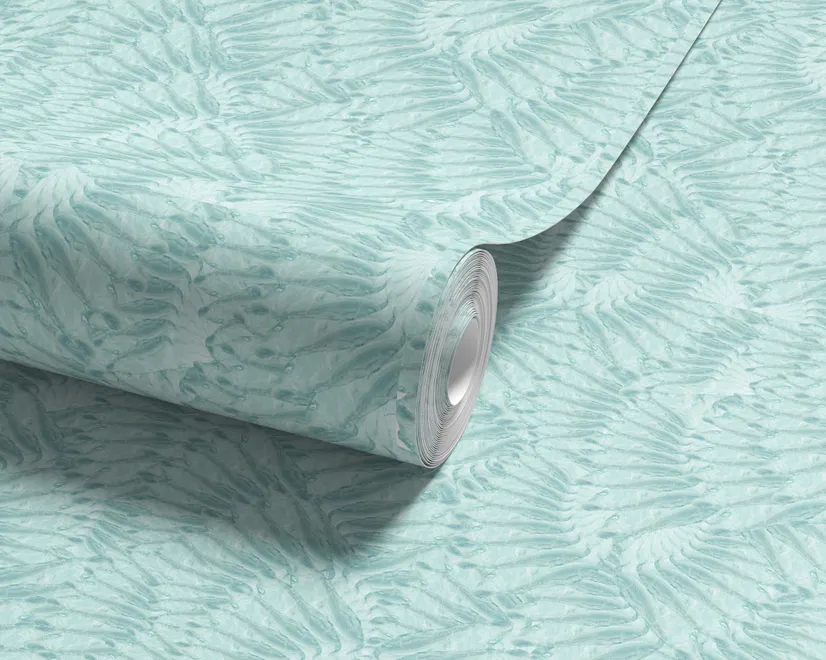 Aqua fern wallpaper with overlapping icy blue palm fronds on a pale aqua ground