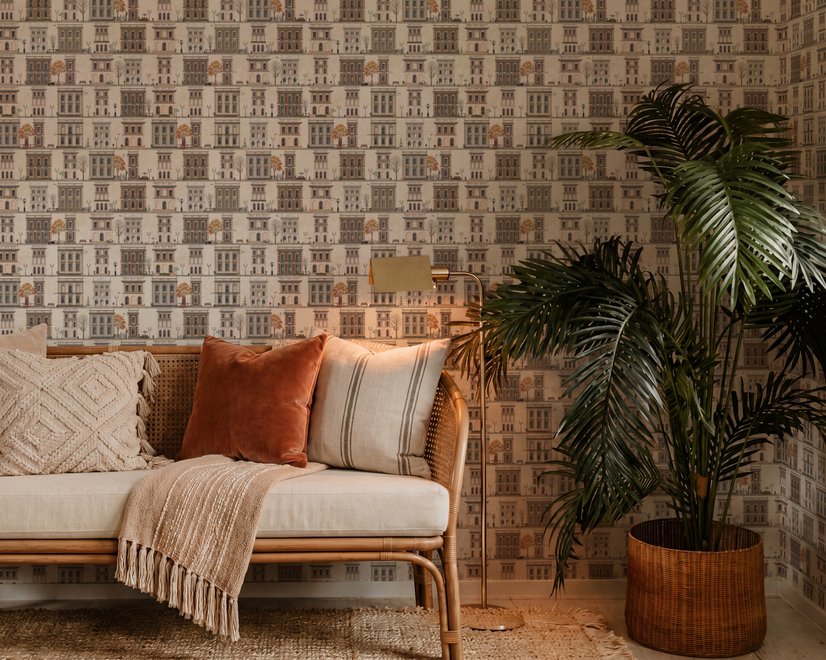 Vintage city wallpaper with illustrated European townhouses, lamps, bicycles, benches and orange-gold trees