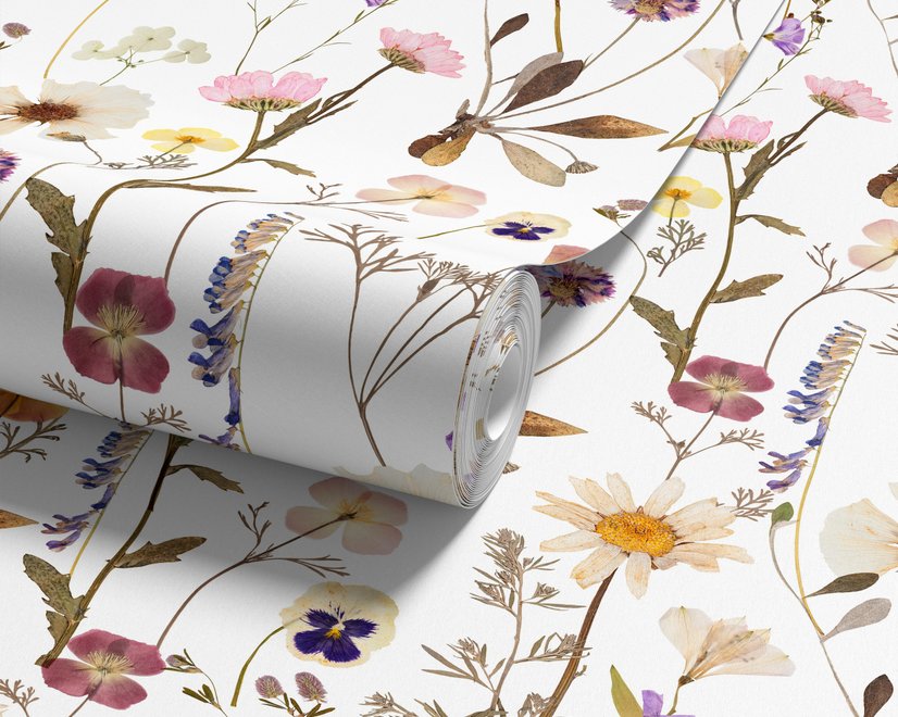 Cute spring wallpaper with pressed ivory, pink, blue and yellow wildflowers on a white ground