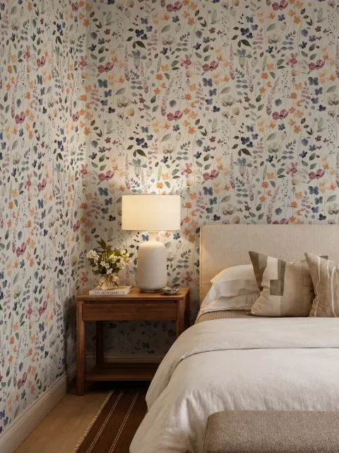 Watercolour floral wallpaper repeat with navy, blue, blush and peach wildflowers on warm cream