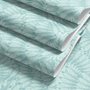 Aqua fern wallpaper with overlapping icy blue palm fronds on a pale aqua ground