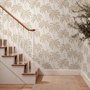 Muted sandy taupe palm trees and pale foliage on a creamy ivory ground tropical wallpaper