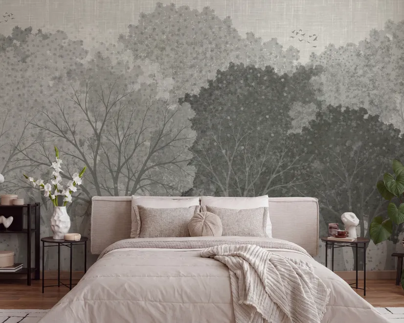 Light gray wallpaper mural with layered ink-wash woodland trees, falling leaves and birds
