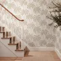 Muted sandy taupe palm trees and pale foliage on a creamy ivory ground tropical wallpaper