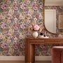 Bold wallpaper for powder room with pop art female faces, pink flowers, black comic panels, mustard, teal and fuchsia details
