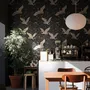 Ivory cranes and antique gold lotus flowers on charcoal-black Japanese lotus wallpaper