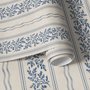 Blue wallpaper with indigo botanical stripework, pinstripes and dotted borders on warm cream parchment