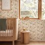 Pink wallpaper with watercolour blush, coral and yellow wildflowers, sage leaves and stems on a warm cream-white ground.