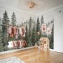 Misty mountain wallpaper mural with tall pine trees, layered green forest and pale foggy ridges