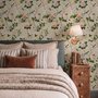 Chinoiserie wallpaper with blue-grey birds, pink peonies, white orchids and green branches on ivory-cream ground