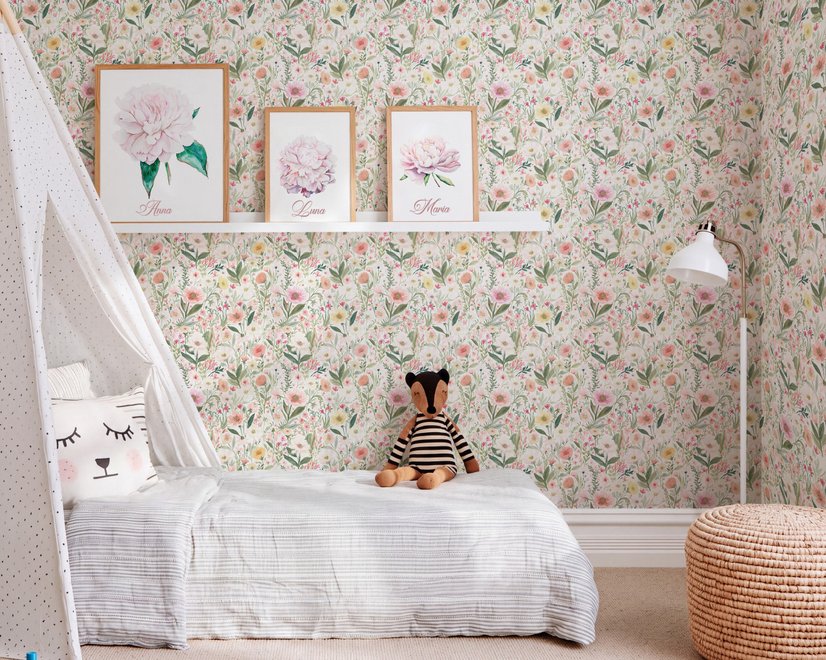 Pink wallpaper with watercolour blush, coral and yellow wildflowers, sage leaves and stems on a warm cream-white ground.