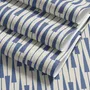 Cream colored wallpaper with denim blue geometric totem stripe repeat on a linen texture ground