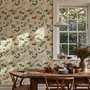 Chinoiserie wallpaper with blue-grey birds, pink peonies, white orchids and green branches on ivory-cream ground