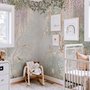 Watercolour nature wallpaper with lilac wisteria, pale trees, sage foliage and small songbirds around a misty clearing