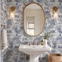 Jungle wallpaper with animals in navy toile, showing tigers, elephants and monkeys on an ivory cream ground