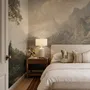 Landscape wallpaper mural with sepia coastal mountains, sailboat, beach figure and foreground tree