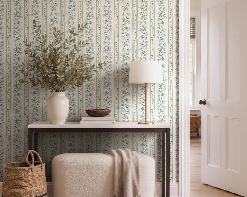 Blue floral stripe wallpaper with pale sky-blue bell flowers, green vines and sage bands on white