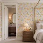 Spring floral wallpaper with pastel watercolour flowers and sage leaves on a clean white ground