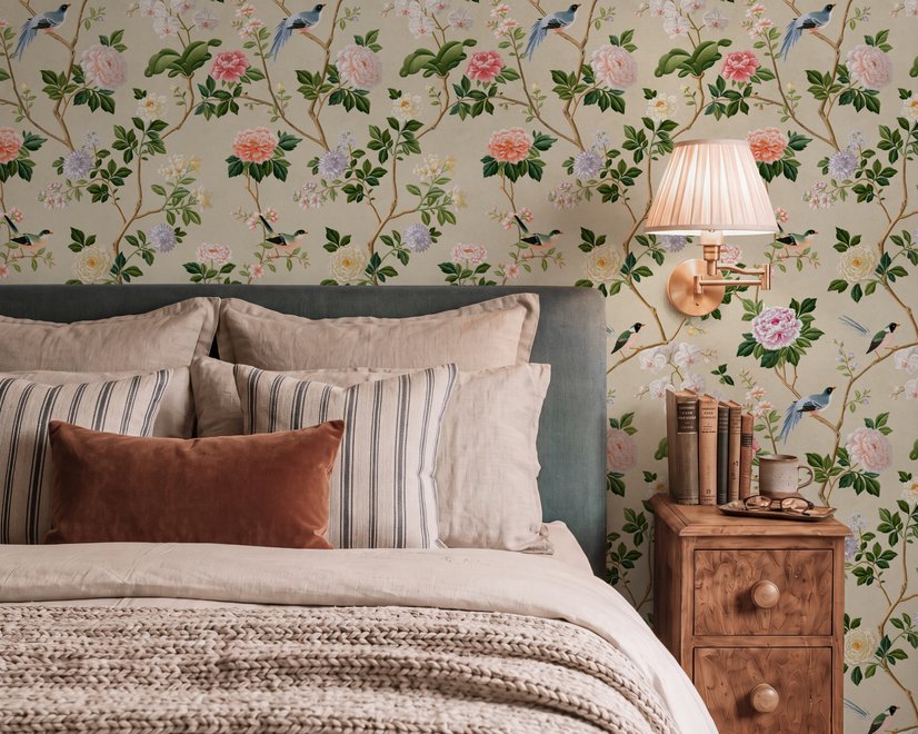 Chinoiserie wallpaper with blue-grey birds, pink peonies, white orchids and green branches on ivory-cream ground