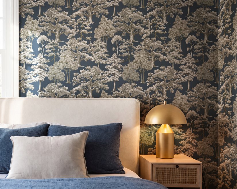 Navy wallpaper with warm ivory and taupe grey toile tree repeat on deep slate blue ground