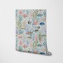 Modern coastal wallpaper with watercolour tropical fish, coral, seaweed, shells and bubbles on light aqua-blue