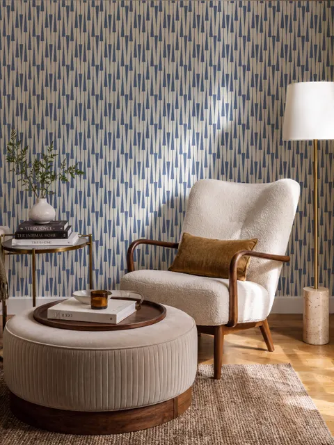 Cream colored wallpaper with denim blue geometric totem stripe repeat on a linen texture ground