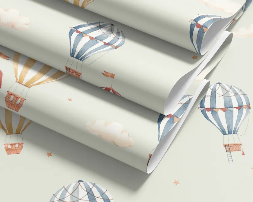 Watercolor blue wallpaper with hot air balloons, cream clouds and peach stars on pale sage green
