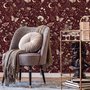 Pink butterflies wallpaper on a claret ground with cream flowers, moons, stars and spotted mushrooms.