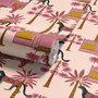 Tropical foliage wallpaper with black panthers, pink palace facades and ochre palms on pale peach
