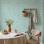Aqua fern wallpaper with overlapping icy blue palm fronds on a pale aqua ground