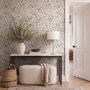 Black outline botanical wallpaper with charcoal wildflowers and grasses on a warm ivory cream ground
