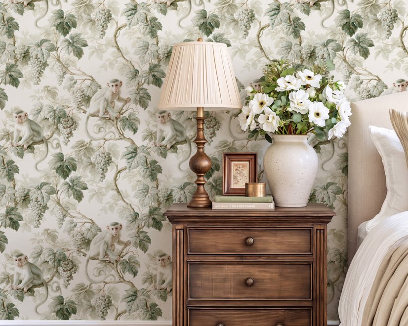 Vintage nature wallpaper with pale monkeys, sage grape leaves, white grape clusters and taupe vines on ivory.
