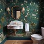 Floral wallpaper with birds in a teal chinoiserie garden with blossoms, pheasant, palms and stone railings