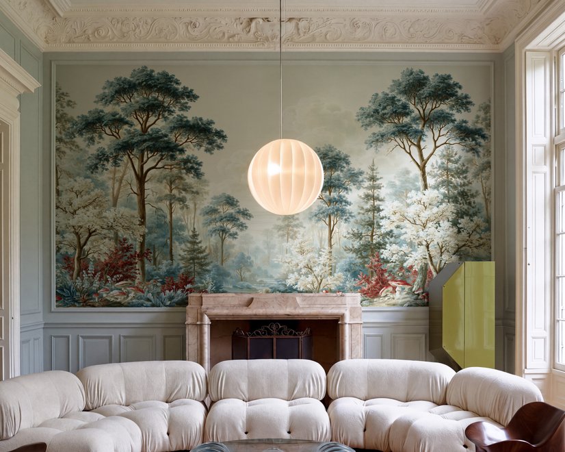 Vintage forest wallpaper mural with blue-grey trees, ivory blossom, red plants and toadstools around a misty path