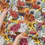 Floral and fish wallpaper with coral blooms, teal fish and black white flowers on metallic mustard-gold ground