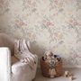 Pink chinoiserie wallpaper with watercolor flowers, blue-grey leaves and red berries on a cream linen-texture ground