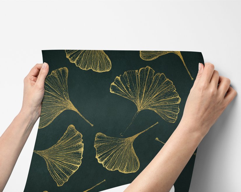 Dark green wallpaper with metallic antique-gold etched ginkgo leaves on a textured forest-green teal ground